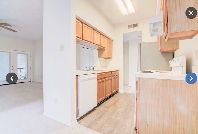 kitchen with sink, ceiling fan, stove, white dishwasher, and light brown cabinets