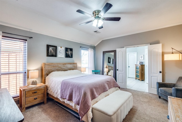 carpeted bedroom with ceiling fan, ornamental molding, and lofted ceiling