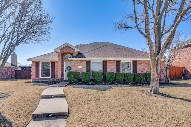 single story home with a front yard