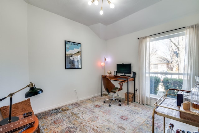 home office featuring lofted ceiling