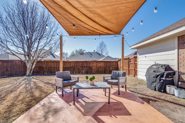 view of patio with grilling area and an outdoor hangout area