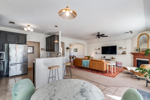 tiled dining room with ceiling fan