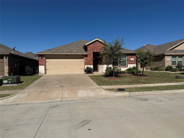 single story home featuring a garage and a front lawn