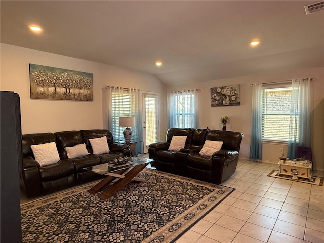 tiled living room featuring vaulted ceiling