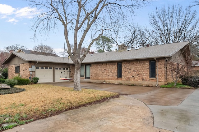 single story home featuring a garage