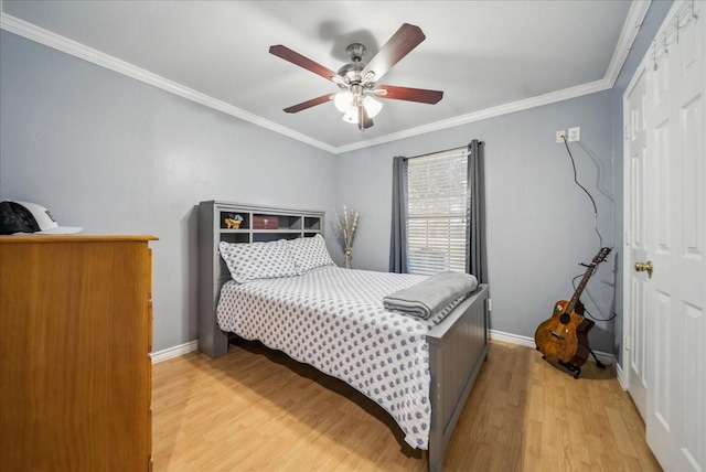 bedroom featuring ornamental molding, light hardwood / wood-style floors, and ceiling fan