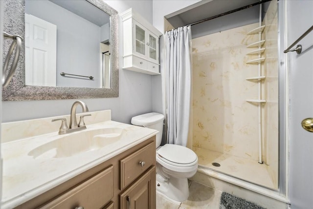 bathroom with vanity, tile patterned flooring, a shower with curtain, and toilet