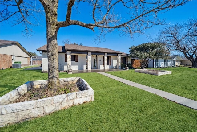 ranch-style home featuring central AC and a front lawn