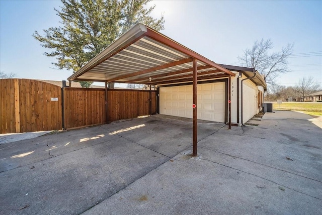 view of parking / parking lot featuring a garage