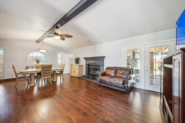 living room with dark hardwood / wood-style floors, lofted ceiling with beams, french doors, and ceiling fan