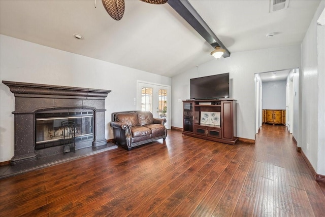 living room featuring lofted ceiling with beams and dark wood-type flooring