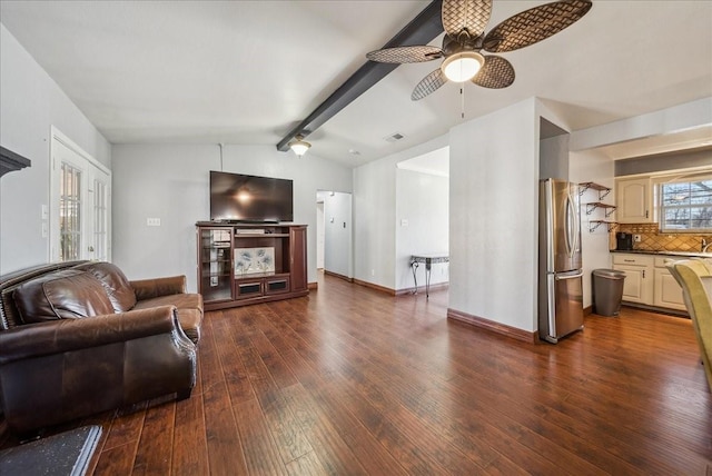 living room with dark wood-type flooring, lofted ceiling with beams, and ceiling fan