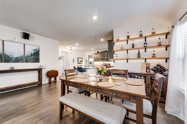 dining space featuring baseboards, dark wood finished floors, visible vents, and recessed lighting