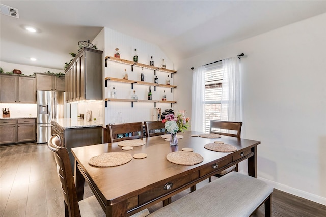 dining space featuring recessed lighting, visible vents, baseboards, vaulted ceiling, and dark wood-style floors