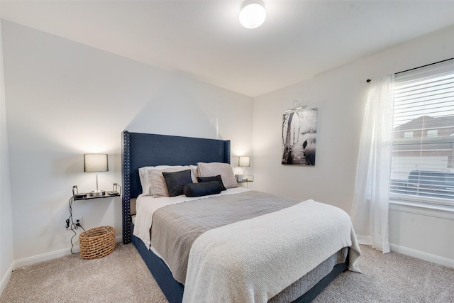 bedroom featuring carpet floors and baseboards