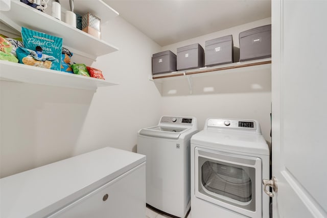 clothes washing area featuring laundry area and washing machine and dryer