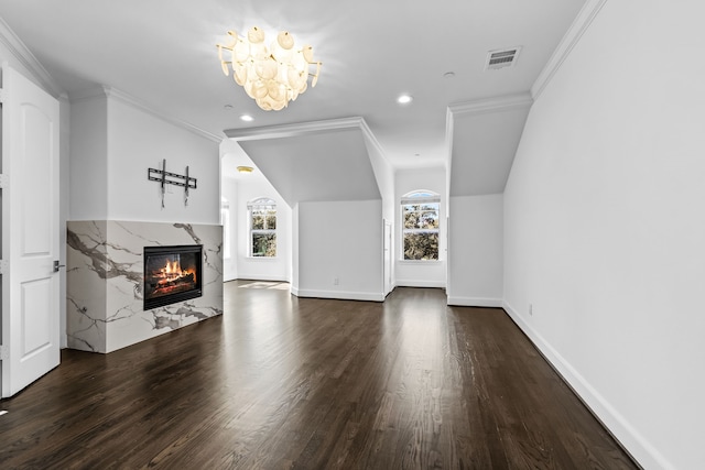 unfurnished living room featuring dark hardwood / wood-style flooring, crown molding, and a fireplace