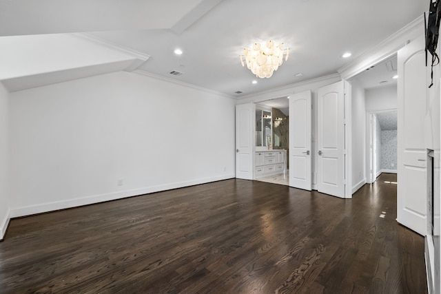 unfurnished bedroom with dark hardwood / wood-style flooring, ornamental molding, lofted ceiling, and a chandelier