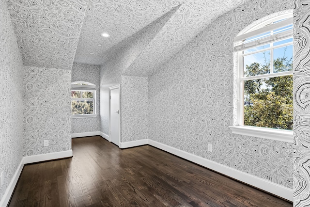 bonus room featuring dark wood-type flooring