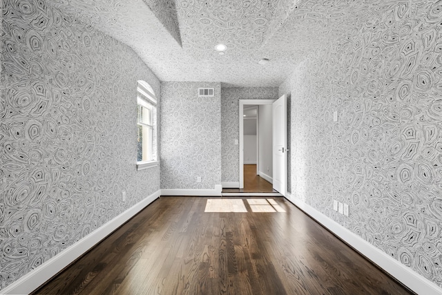 unfurnished room featuring hardwood / wood-style floors