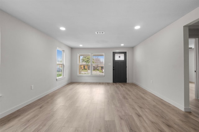 foyer entrance featuring recessed lighting, visible vents, baseboards, and light wood-style flooring