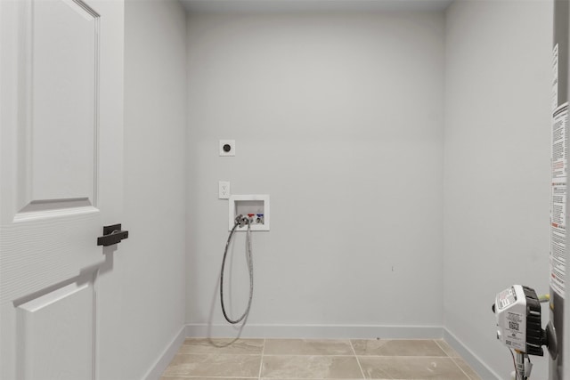 laundry room featuring laundry area, hookup for a washing machine, baseboards, and electric dryer hookup