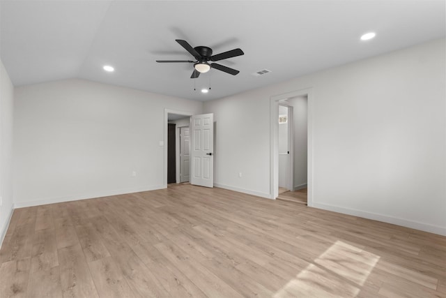 interior space with light wood-type flooring, visible vents, lofted ceiling, recessed lighting, and baseboards