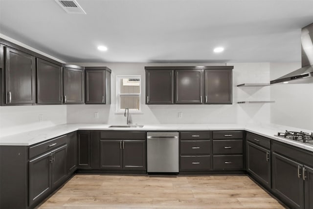 kitchen featuring visible vents, a sink, open shelves, appliances with stainless steel finishes, and light wood finished floors