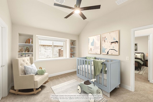 sitting room with lofted ceiling, carpet, and built in features