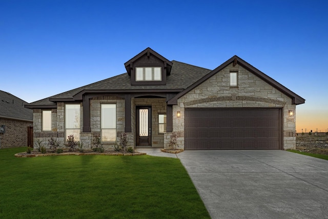 french country inspired facade featuring a garage, driveway, and a lawn