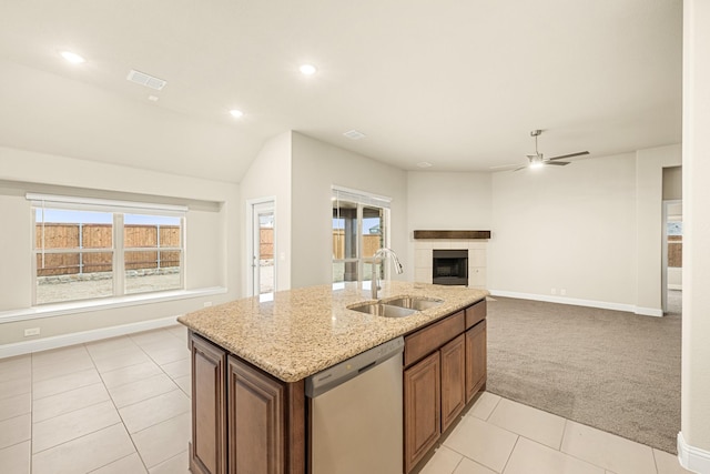 kitchen with a kitchen island with sink, a sink, visible vents, open floor plan, and stainless steel dishwasher