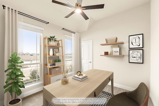 carpeted office featuring baseboards, vaulted ceiling, and a ceiling fan