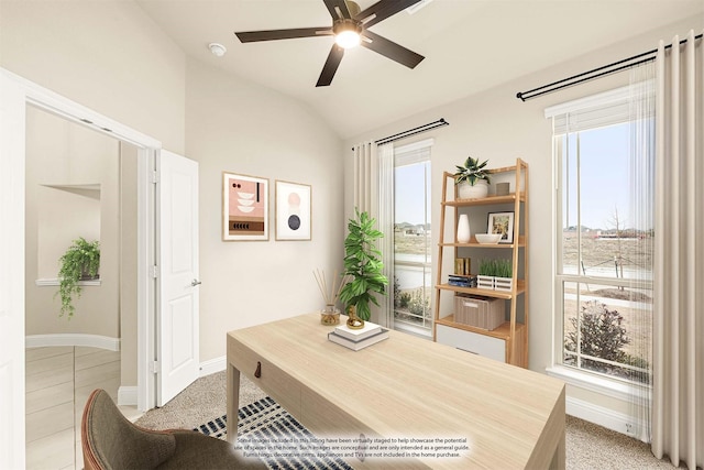 office area featuring a ceiling fan, vaulted ceiling, and baseboards