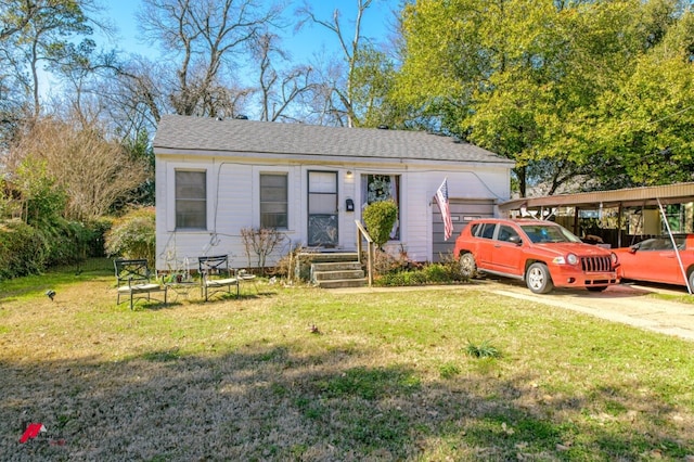 view of front facade with a carport and a front lawn