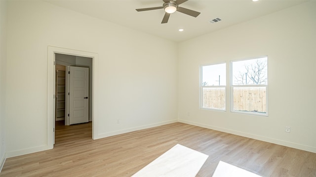 spare room with ceiling fan and light hardwood / wood-style flooring