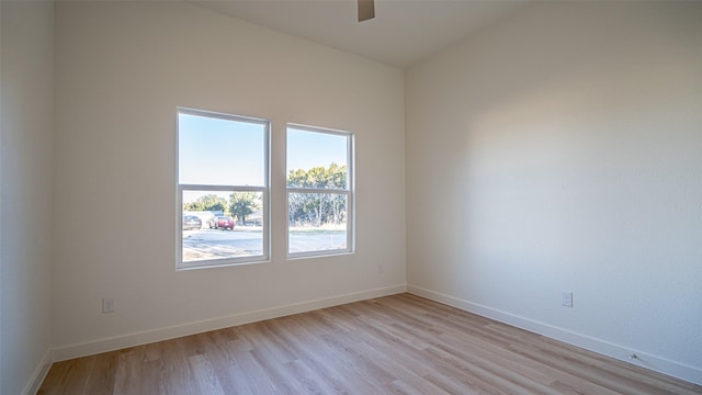 spare room featuring ceiling fan and light wood-type flooring