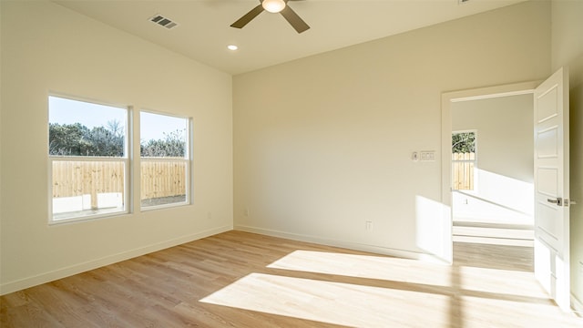 empty room featuring ceiling fan and light wood-type flooring