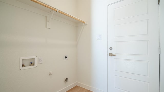 laundry area with electric dryer hookup, washer hookup, and light hardwood / wood-style flooring