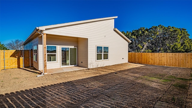 back of house featuring a patio area