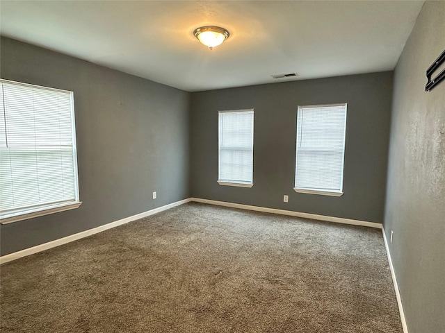 unfurnished room with carpet floors