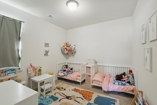 carpeted bedroom with visible vents