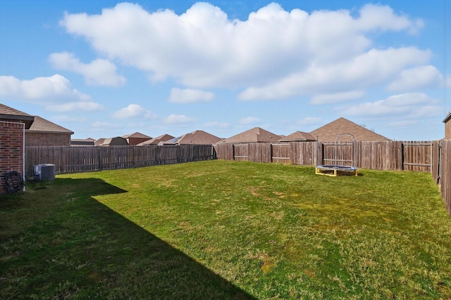 view of yard featuring cooling unit and a fenced backyard