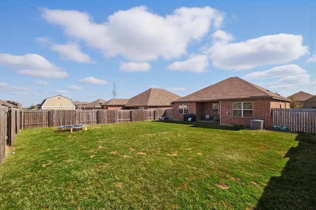 view of yard with cooling unit and a fenced backyard