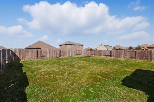 view of yard featuring a fenced backyard