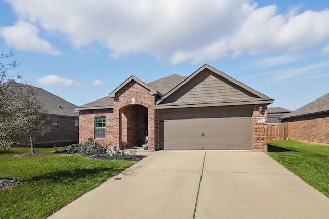 ranch-style home featuring a garage, a front yard, concrete driveway, and brick siding