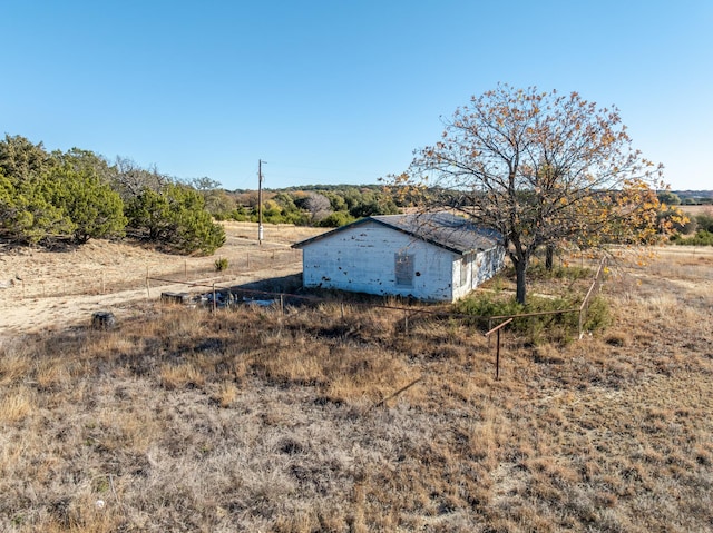 view of yard with a rural view