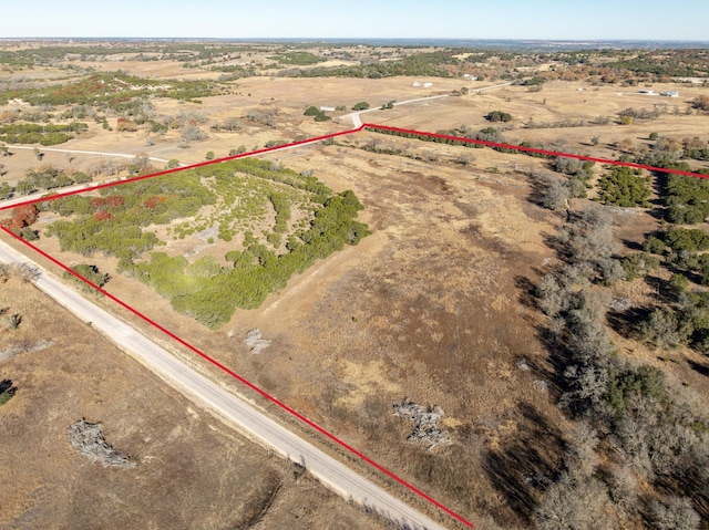 birds eye view of property featuring a rural view