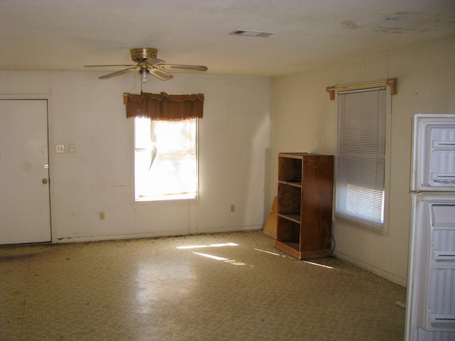 spare room with ceiling fan