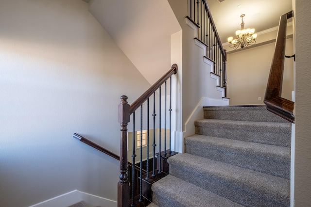 stairway featuring crown molding and a notable chandelier