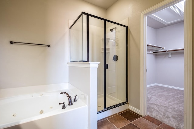 bathroom with tile patterned floors and independent shower and bath